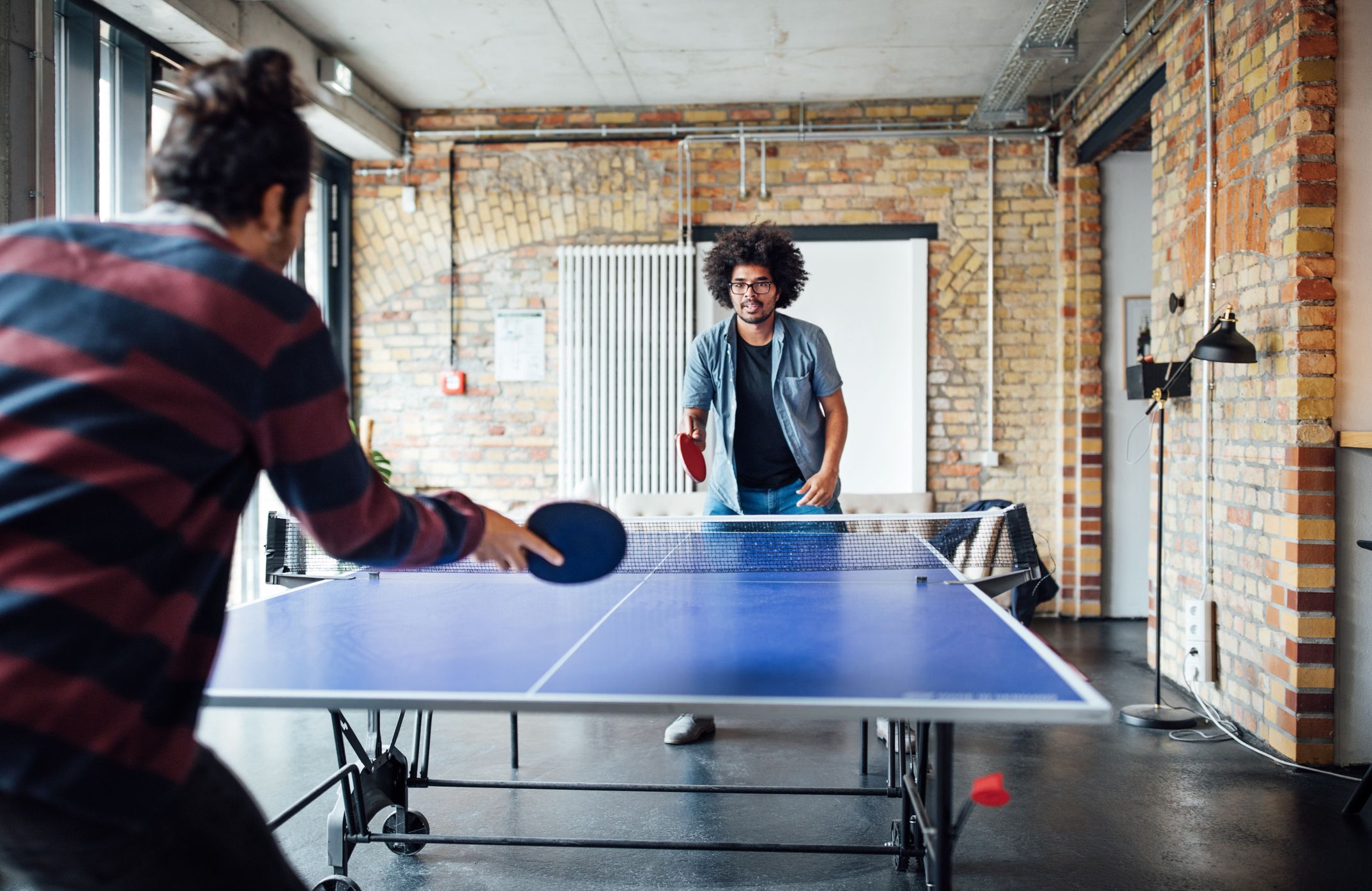 73-businessman-playing-table-tennis-with-colleague-royalty-free-image-1652384248